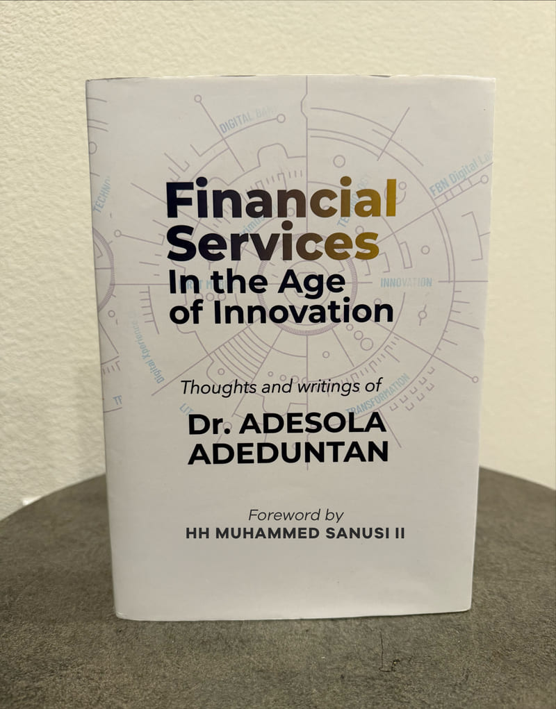 Hardback copy of Financial Services In the Age of Innovation standing on a table.